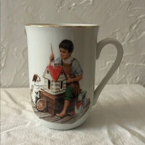This is a Norman Rockwell Museum "A Dollhouse for Sis" porcelain mug